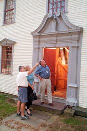 Checking out the features of an antique doorway in Historic Deerfield.